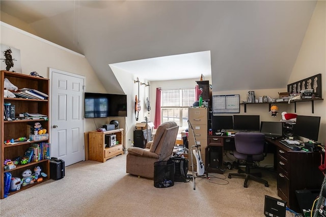 carpeted home office featuring lofted ceiling