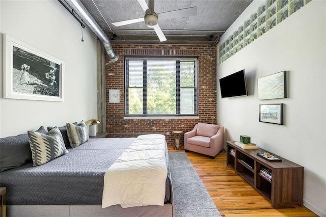3235 Roswell Rd NE Unit 505, Atlanta, GA 30305 - bedroom with brick wall and wood finished floors
