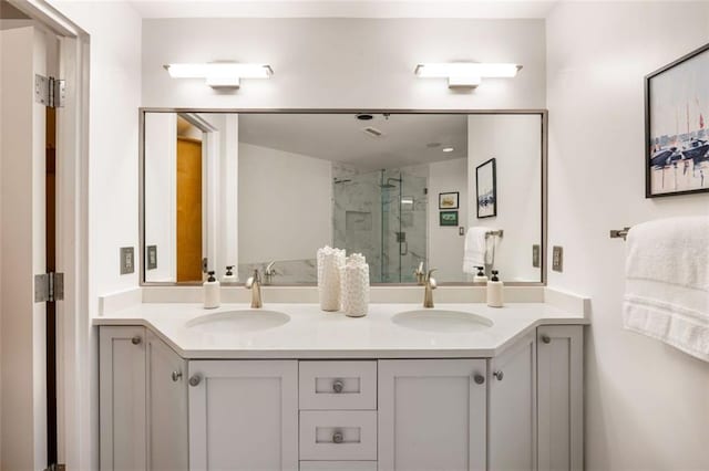 3235 Roswell Rd NE Unit 505, Atlanta, GA 30305 - bathroom with double vanity and a marble finish shower