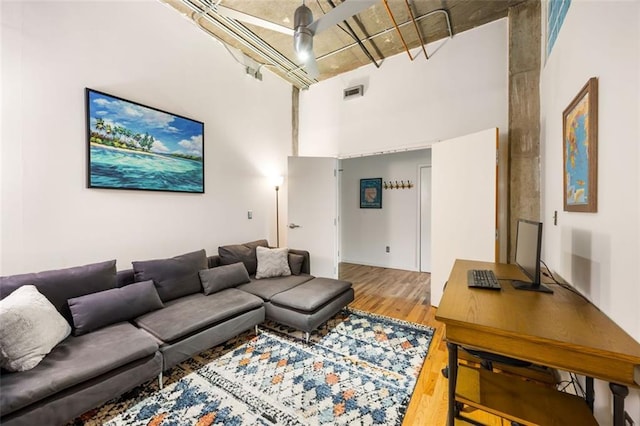 3235 Roswell Rd NE Unit 505, Atlanta, GA 30305 - living area with wood finished floors, a high ceiling, and an office area