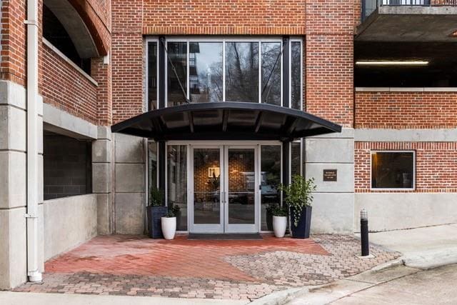3235 Roswell Rd NE Unit 505, Atlanta, GA 30305 - property entrance with french doors and brick siding