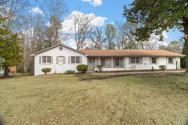 view of front facade with a front lawn and a porch