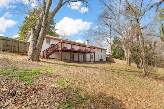 back of house with a deck