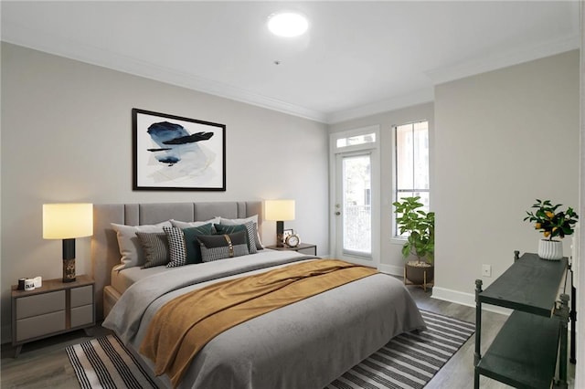 bedroom featuring hardwood / wood-style floors and crown molding