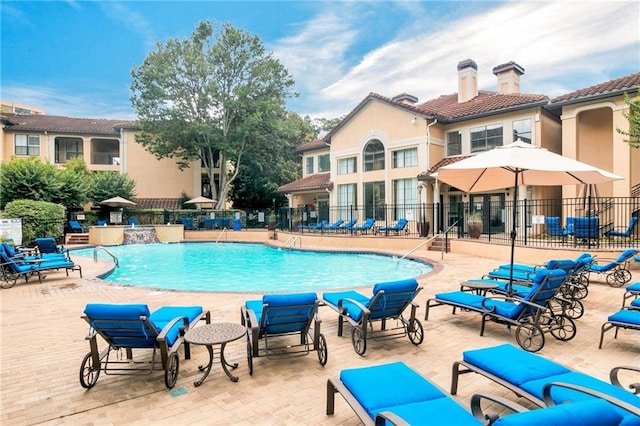 view of swimming pool featuring a patio