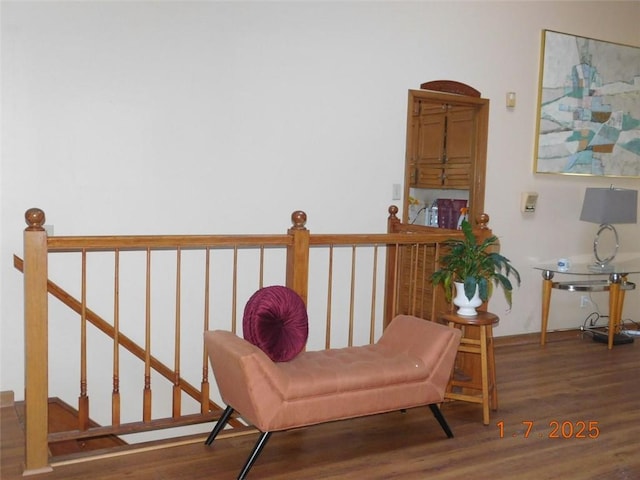 sitting room featuring dark wood-type flooring