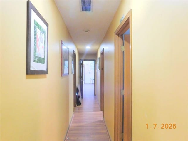 hall featuring wood-type flooring