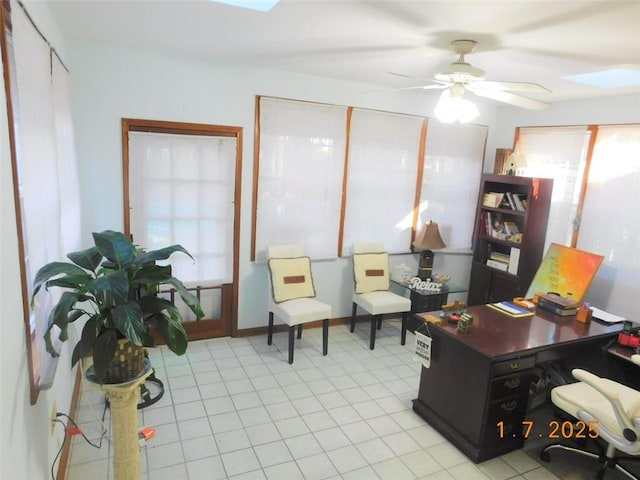 tiled office featuring ceiling fan