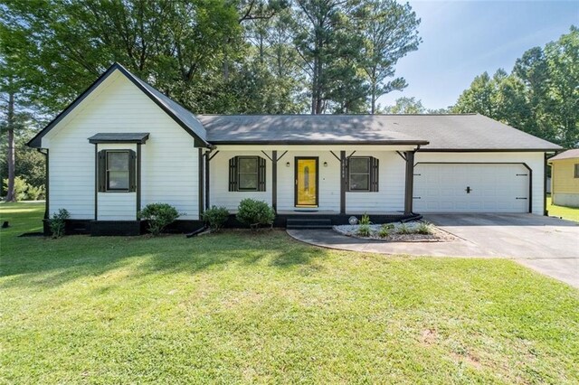 10100 Clearview Dr NW, Covington, GA 30014 - ranch-style home with an attached garage, covered porch, a front lawn, and concrete driveway