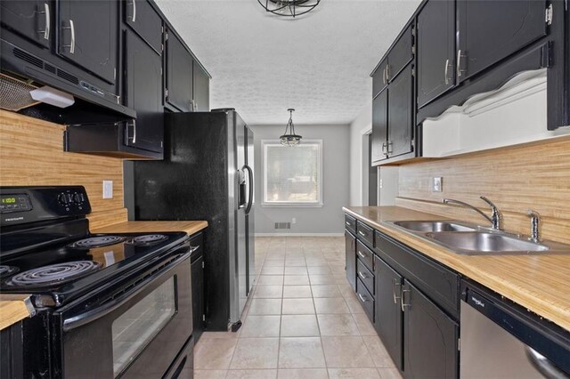 kitchen with dishwasher, decorative backsplash, black electric range, sink, and light tile patterned floors