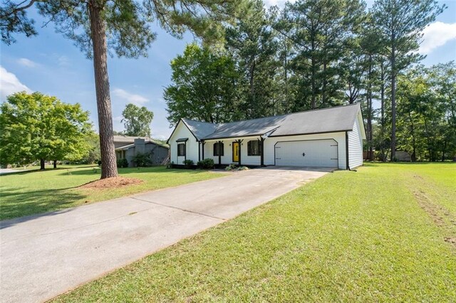 single story home with a front lawn and a garage