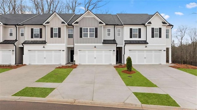 321 Sound Cir, Stockbridge, GA 30281 - multi unit property featuring a garage, a standing seam roof, and driveway