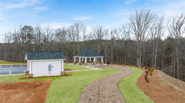 321 Sound Cir, Stockbridge, GA 30281 - view of grassy yard featuring a wooded view and an outbuilding