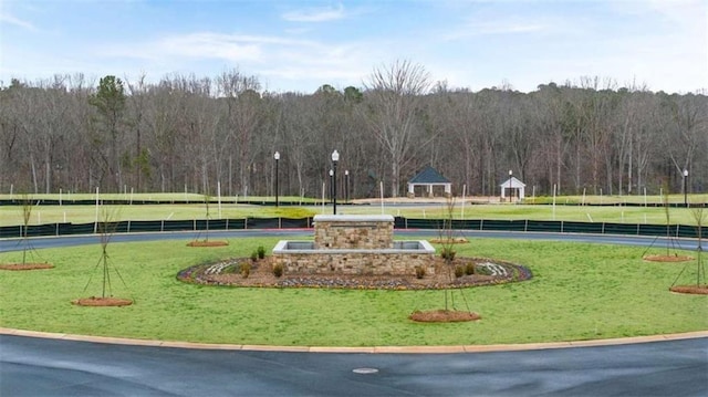 321 Sound Cir, Stockbridge, GA 30281 - view of community with a lawn and a wooded view