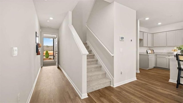 321 Sound Cir, Stockbridge, GA 30281 - stairway with wood finished floors and recessed lighting
