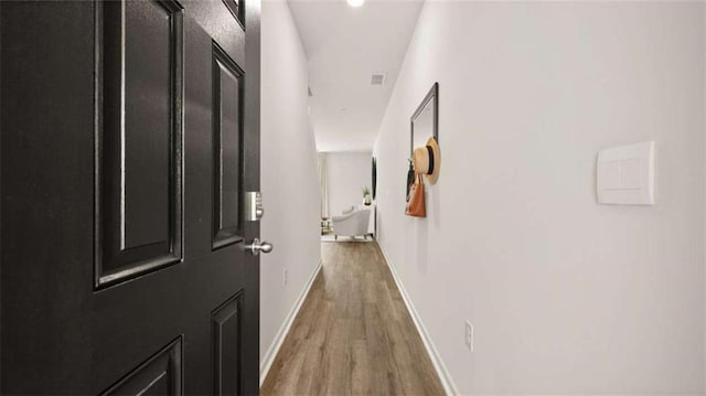 321 Sound Cir, Stockbridge, GA 30281 - hallway with wood finished floors and baseboards
