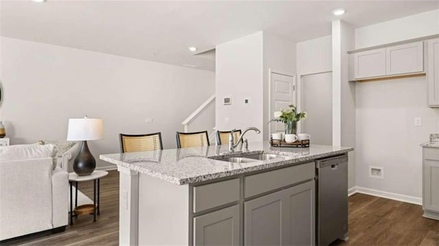 321 Sound Cir, Stockbridge, GA 30281 - kitchen with dishwasher, dark wood-type flooring, gray cabinets, a kitchen island with sink, and open floor plan