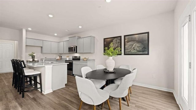 321 Sound Cir, Stockbridge, GA 30281 - dining room with wood finished floors and recessed lighting