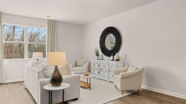 321 Sound Cir, Stockbridge, GA 30281 - living area featuring wood finished floors and baseboards