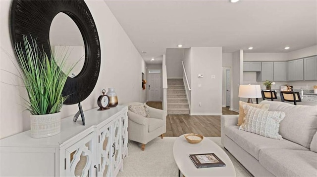 321 Sound Cir, Stockbridge, GA 30281 - living room featuring light wood-type flooring, stairs, and recessed lighting
