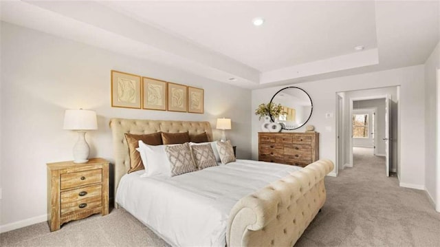 321 Sound Cir, Stockbridge, GA 30281 - bedroom featuring light colored carpet, a tray ceiling, and recessed lighting