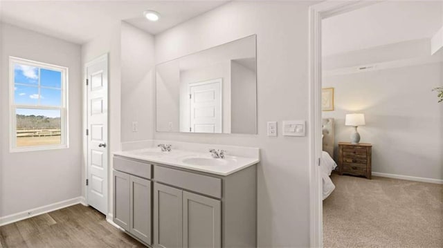 321 Sound Cir, Stockbridge, GA 30281 - ensuite bathroom with double vanity and baseboards