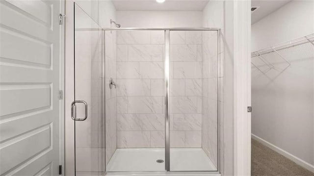 321 Sound Cir, Stockbridge, GA 30281 - full bath featuring a shower stall and a spacious closet
