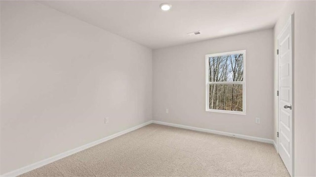 321 Sound Cir, Stockbridge, GA 30281 - empty room with light colored carpet and recessed lighting