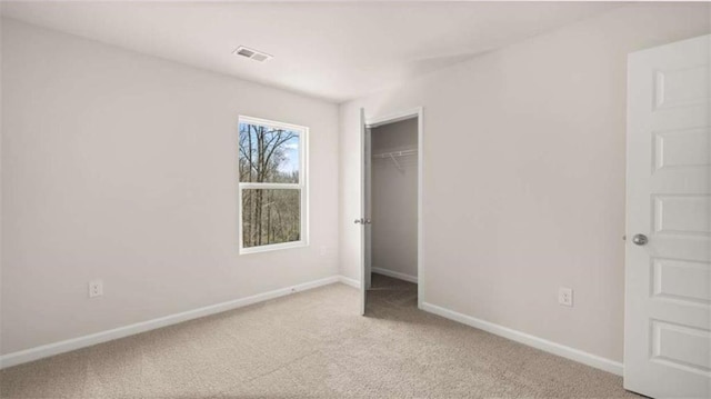 321 Sound Cir, Stockbridge, GA 30281 - unfurnished bedroom with carpet floors and a closet