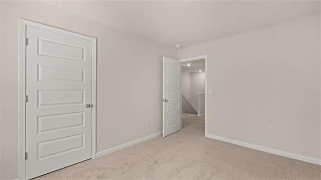 321 Sound Cir, Stockbridge, GA 30281 - unfurnished bedroom with light carpet and baseboards