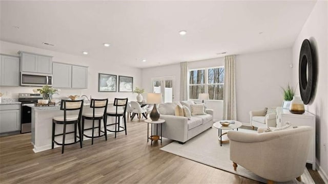321 Sound Cir, Stockbridge, GA 30281 - living area featuring wood finished floors and recessed lighting