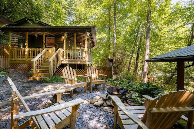 exterior space with stairs and an outdoor fire pit