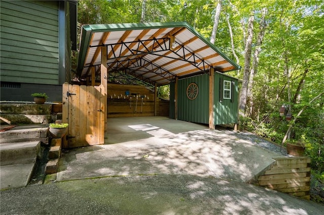 exterior space with a carport and concrete driveway