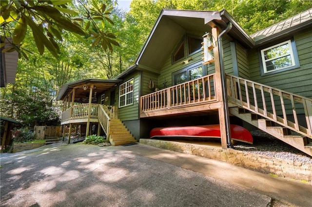 exterior space featuring a deck and stairway