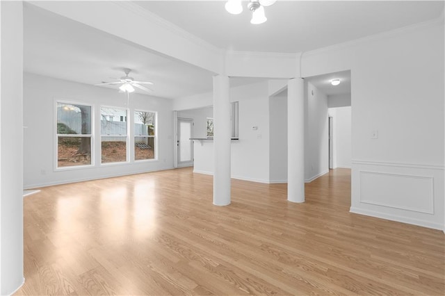 unfurnished living room with ceiling fan, light hardwood / wood-style floors, and ornamental molding