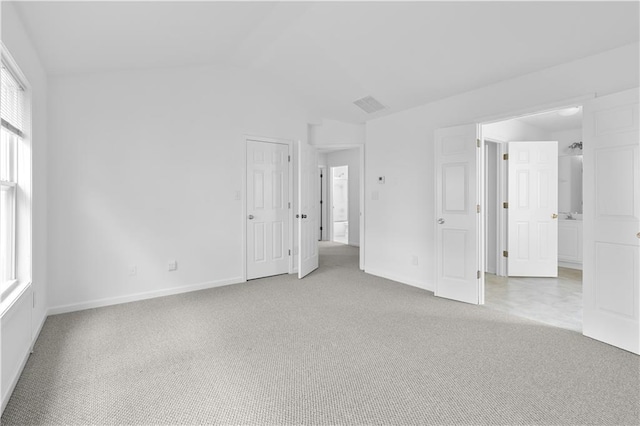 spare room with light carpet