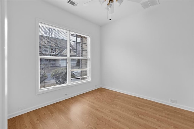 unfurnished room with ceiling fan and light wood-type flooring