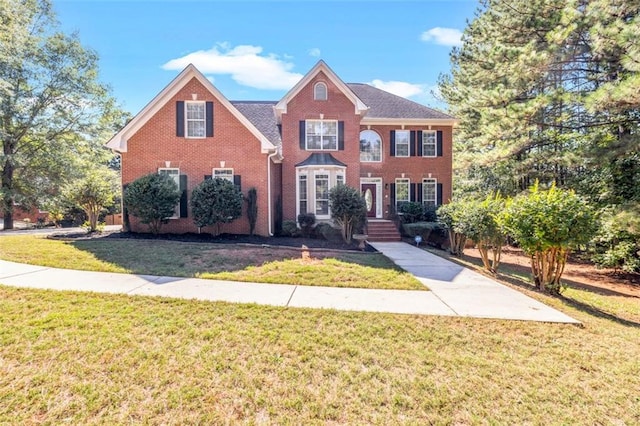 view of front of home with a front lawn