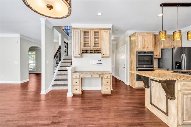 kitchen featuring dark wood-type flooring, crown molding, light stone counters, and stainless steel appliances