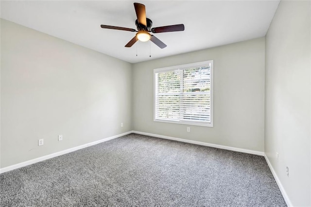 spare room with carpet flooring and ceiling fan