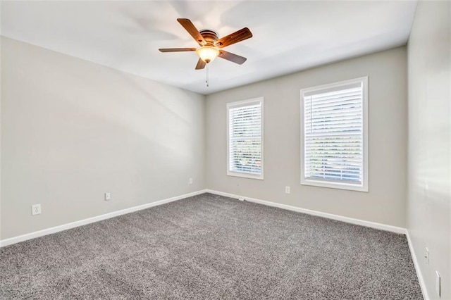 spare room featuring carpet flooring and ceiling fan