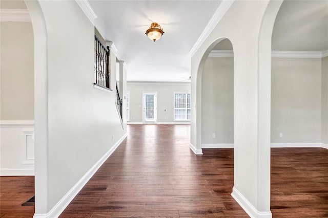 hall featuring ornamental molding and dark hardwood / wood-style flooring