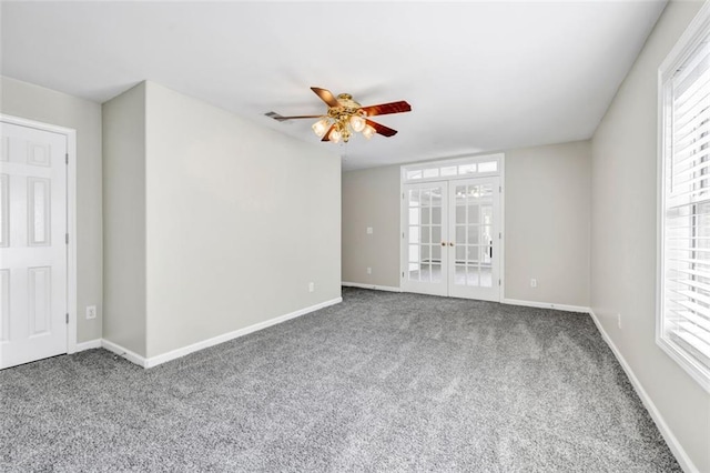 empty room with french doors, carpet floors, and ceiling fan