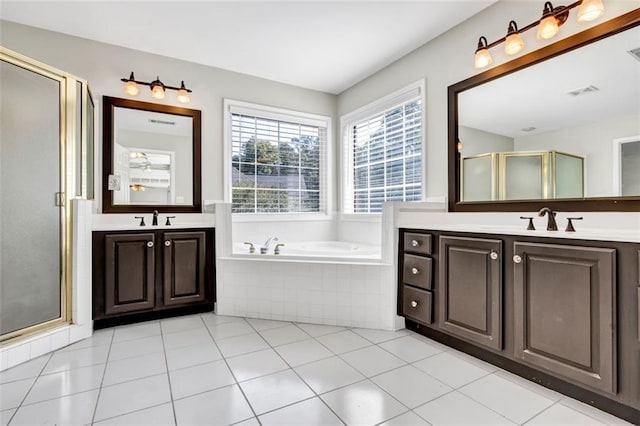 bathroom with vanity, tile patterned floors, and separate shower and tub