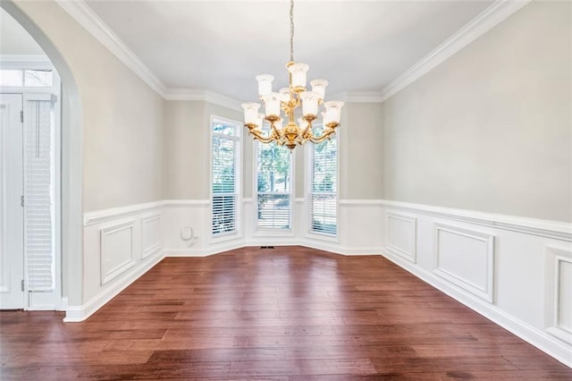 unfurnished dining area with crown molding, dark hardwood / wood-style floors, and a notable chandelier