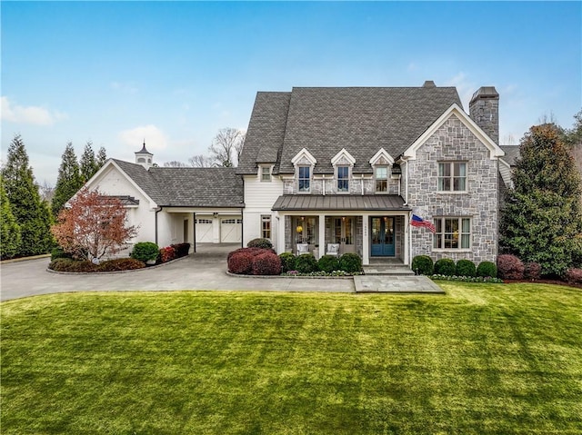 view of front of house with a front yard and a porch