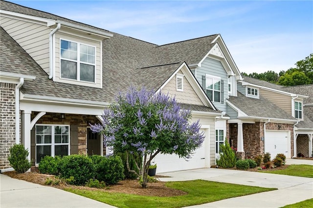 1637 Short Shadow Ln, Snellville, GA 30078 - view of front of property with driveway, a shingled roof, and stone siding