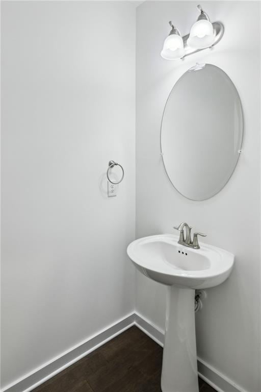 1637 Short Shadow Ln, Snellville, GA 30078 - bathroom featuring baseboards and wood finished floors