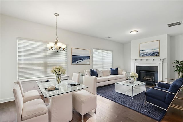 1637 Short Shadow Ln, Snellville, GA 30078 - dining room with a chandelier, wood finished floors, and a fireplace