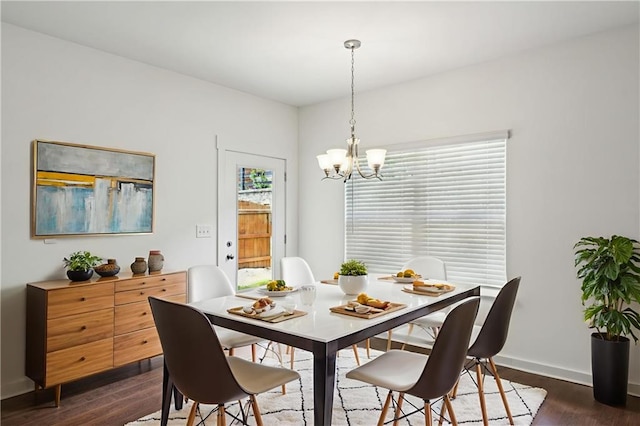1637 Short Shadow Ln, Snellville, GA 30078 - dining room featuring a chandelier and dark wood finished floors